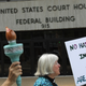 Protesters rally against the separation of immigrant families in front of a U.S. federal court on July 11, 2018 in Bridgeport, Connecticut.